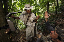 Biologist Franz Kaston Florez demonstrating how to use photo trap for tapir identification, Sierra Nevada de Santa Marta National Park, Colombia