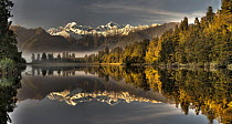 Dawn reflection of Lake Matheson with Mount Tasman and Mount Cook, Westland National Park, New Zealand