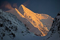 Snow blowing from Mount Tasman and Silberhorn at dawn, Mount Cook National Park, New Zealand
