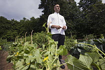 President Obama's personal chef Sam Kass in Michelle Obama's vegetable garden, White House, Washington D.C.