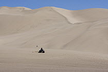 Dumont Dunes Off-Highway Vehicle Area with person riding ATV, Mojave Desert, California