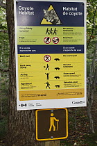 Coyote warning sign, Cape Breton Highlands National Park, Nova Scotia, Canada