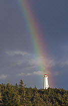 Lighthouse and rainbow, Louisbourg Cape, Breton, Nova Scotia, Canada