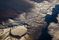 Snow-covered volcano showing caldera, Andes, Chile