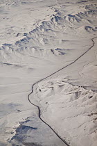 Road running through Gobi Desert in winter, Mongolia