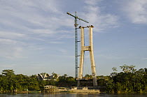 Bridge being built across Napo River to connect the town of Coca with Yasuni National Park, Amazon, Ecuador