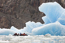 Tourists in zodiacs looking at icebergs, Alaska