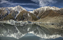 Reflection of peaks and icebergs in lake, Tasman Glacier, Mount Cook National Park, New Zealand
