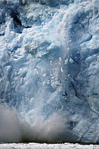 Ice falling off glacier, Alaska