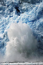 Ice falling off glacier, Alaska