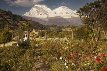 Huascaran Mountain peak in Cordillera Blanca above city of Yungay and memorial garden for 50,000 victims of 1970 avalanche, Andes, Peru