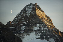 Crescent moon and summit of Mount Assiniboine, Mount Assiniboine Provincial Park, British Columbia, Canada
