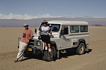 Michael and Patricia Fogden with a vehicle, Namib Desert, Gobabeb, Namibia