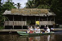 Tourists in boat at Tortuguero Lodge National Park, Costa Rica