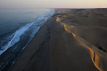Sand dunes and Pacific Ocean south of Walvis Bay, Namib Desert, Namibia