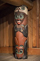 Carved post supports house and symbolizes the exploits of Duk-toothl, Totem Bight State Historical Park, Ketchikan, Alaska