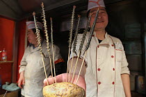 Centipedes scewered for sale as food, Xiao Chi Jie Market, Beijing, China