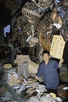 Shop owner in traditional chinese medicine market, Sichuan, China