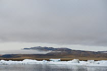 Mountain range and ice floes, Wrangel Island, Russia