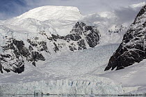 Avalanche rolling down mountain, Paradise Bay, Antarctic Peninsula, Antarctica
