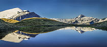 Mount Aspiring reflected in high mountain lake, Cascade Saddle, Mount Aspiring National Park, Otago, New Zealand