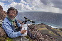 Short-tailed Albatross (Phoebastria albatrus) researcher Professor Hiroshi Hasegawa on his 109th expedition to conduct the annual egg count, Torishima Island, Japan