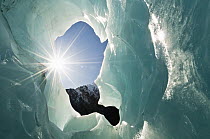 Ice cave and sunburst, Franz Josef Glacier, Westland National Park, New Zealand