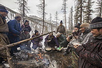 Tsataan men drinking tea and chating in winter camp, Hunkher Mountains, northern Mongolia