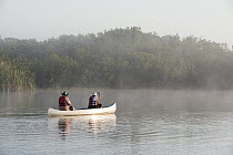 Canoeists at dawn, Everglades National Park, Florida