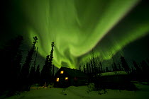 Aurora borealis over house, Alaska