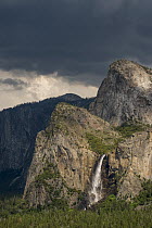 Rock formations and waterfall, Lower and Middle Cathedral Rocks, Bridal Veil Falls, Yosemite National Park, California