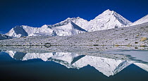 Kangshung Face, South Col and Lhotse reflected in small glacial pond, Mount Everest, Tibet