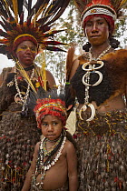 Women and girl in ritual make-up and traditional clothing during a sing-sing, Goroka Show, Goroka, Eastern Highlands, Papua New Guinea