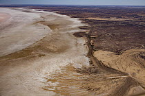 River spilling into salt lake, Lake Eyre, South Australia, Australia