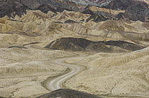 Dirt road winding through rock formations, Twenty Mule Team Canyon, Death Valley National Park, California