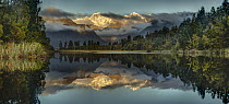 Mountains reflected in lake at sunset, Lake Matheson, Mount Tasman and Mount Cook, Westland National Park, South Island, New Zealand