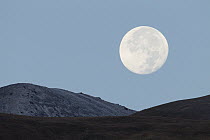 Full moon over mountains, Sarychat-Ertash Strict Nature Reserve, Tien Shan Mountains, eastern Kyrgyzstan