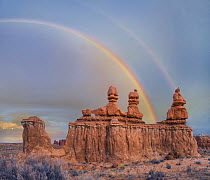 Rainbow over rock formation called the Three Judges, Goblin Valley State Park, Utah