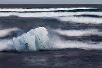 Glacial ice hit by waves, Jokalsarlon Lagoon, southern Iceland