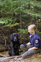 Domestic Dog (Canis familiaris) named Sampson, a scent detection dog with Conservation Canines, with field technician Julianne Ubigau, northeast Washington