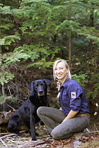 Domestic Dog (Canis familiaris) named Sampson, a scent detection dog with Conservation Canines, and field technician Julianne Ubigau, northeast Washington