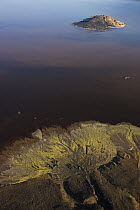 Heavily eroded volcano in Lake Logipi, Kenya