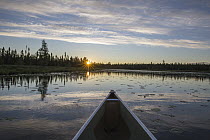 Kayak at sunrise on Junco River, Superior National Forest, Minnesota