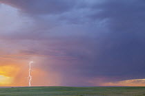 Lightning strike over prairie, Badlands National Park, South Dakota