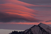 Clouds at sunrise over mountain range, Torres del Paine National Park, Patagonia, Chile
