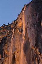 Horsetail Fall, low sun angle lights the rock wall during sunset creating a firefall, Yosemite National Park, California