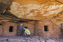 Tourists at Fallen Roof granaries ruin, Bears Ears National Monument, Utah