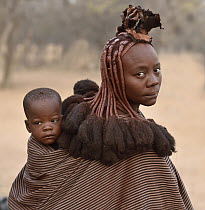 Married Himba woman with child, Kaokoveld Desert, Namibia
