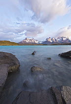 Rocks along lakeshore and granite peaks in spring, Lake Pehoe, Torres del Paine, Torres del Paine National Park, Patagonia, Chile