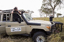 African Lion (Panthera leo) biologists, Xia Stevens and Milan Vinks, searching for pride, Busanga Plains, Kafue National Park, Zambia